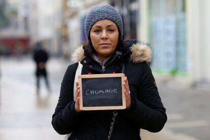 Malika Etchekopar-Etchart, 38, unemployed, holds a blackboard with the word "chomage" (unemployment), the most important election issue for her, as she poses for Reuters in Chartres, France February 1, 2017. She said: "It's more and more difficult to find a job. A few years back, it was a lot easier." REUTERS/Stephane Mahe SEARCH "ELECTION CHARTRES" FOR THIS STORY. SEARCH "THE WIDER IMAGE" FOR ALL STORIES