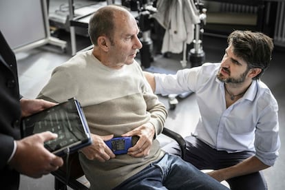 Project manager and head of Parkinson’s activities at NeuroRestore, Eduardo Martín Moraud (right), talks with Marc Gautier in Lausanne, Switzerland, on November 3. 
