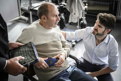 Project manager and head of Parkinson’s activities at NeuroRestore, Eduardo Martín Moraud (right), talks with Marc Gautier in Lausanne, Switzerland, on November 3.
