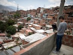 CARACAS, VENEZUELA - APRIL 27: A teenager student Jose Lara uses his computer at the roof of his house whilte trying to connect to the internet and receive his homework for the week during the second month of quarantine in the Country on April 27, 2020 in Caracas, Venezuela. Due to the government-ordered coronavirus lockdown, students in Venezuela will have to attend classes remotely until the end of the school year on July 10th. In most cases, teachers connect with their students daily or weekly through e-mail or social media. Online education is a challenge in a country with a very unstable and slow internet service, frequent power outages and low-income households where parents lack of time to spend teaching their kids. (Photo by Leonardo Fernandez Viloria/Getty Images)