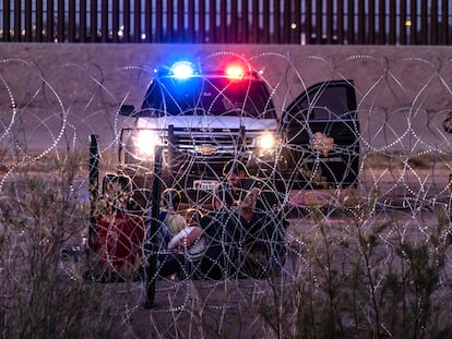 A family of migrants is detained by U.S. Border Patrol agents as they cross the Rio Grande from Ciudad Juarez on May 11, 2023.