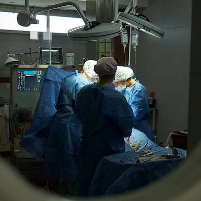 View from outside the delivery room of a woman giving birth