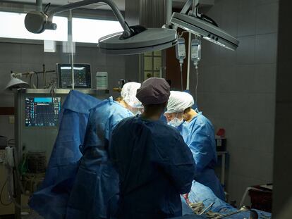 View from outside the delivery room of a woman giving birth