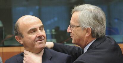 Luis de Guindos y Jean-Claude Juncker.