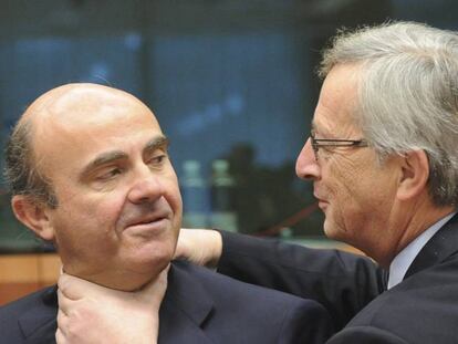 Luis de Guindos y Jean-Claude Juncker.