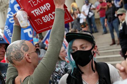 Protesters rally outside the State Capitol building after former Vice President Joe Biden was declared the winner of the 2020 U.S. presidential election, in Lansing, Michigan