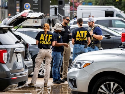 Authorities secure the area of the shooting in Dallas.