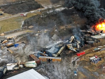 In this photo taken with a drone, portions of a Norfolk Southern freight train that derailed the previous night in East Palestine, Ohio, remain on fire at mid-day on Feb. 4, 2023.