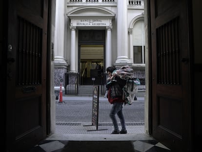 A man walks in front of the headquarters of the Central Bank of Argentina, in Buenos Aires.