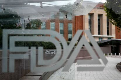 A U.S. Food and Drug Administration building is seen behind FDA logos at a bus stop on the agency's campus in Silver Spring, Md., on Aug. 2, 2018. Federal health advisers voted against an experimental treatment for Lou Gehrig’s disease at a Wednesday, Sept. 27, 2023