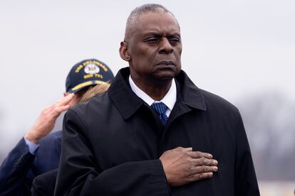 US Secretary of Defense Lloyd Austin watches a US Army carry team move a flag-draped transfer case containing the remains of a fallen US service member during a dignified transfer at Dover Air Force Base in Dover, Delaware, February 02, 2024.