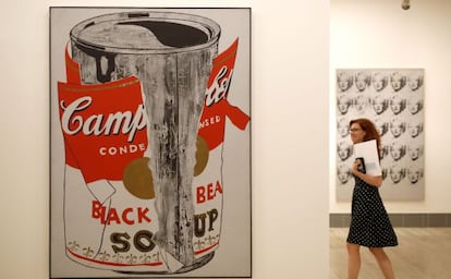 A visitor next to Warhol’s ‘Big Torn Campbell's Soup Can.’