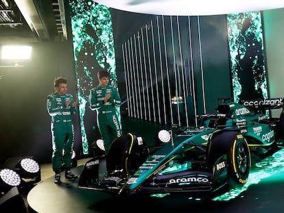 A handout picture released by Aston Martin shows the team's Formula 1 drivers Fernando Alonso (L) and Lance Stroll standing with the Aston Martin AMR23 Formula One racing car for the 2023 season, during its unveiling at their headquarters in Silverstone on February 13, 2023. (Photo by ASTON MARTIN / AFP) / RESTRICTED TO EDITORIAL USE - MANDATORY CREDIT "AFP PHOTO / ASTON MARTIN" - NO MARKETING NO ADVERTISING CAMPAIGNS - DISTRIBUTED AS A SERVICE TO CLIENTS