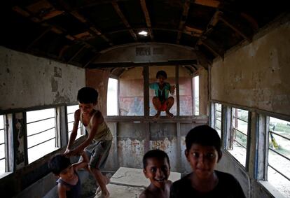 Children play inside an abandoned railway coach of the Nepal Railway Corporation Ltd., in Janakpur, Nepal, June 4, 2017. REUTERS/Navesh Chitrakar SEARCH "CHITRAKAR RAILWAY" FOR THIS STORY. SEARCH "WIDER IMAGE" FOR ALL STORIES.