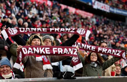 Fans hold up scarves that read 'Thank you Franz' during the Memorial ceremony for Franz Beckenbauer in Munich, Germany, 19 January 2024.