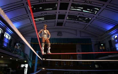 Cassandro on poses on the third rope, during a photo shoot in London, in July 2008.