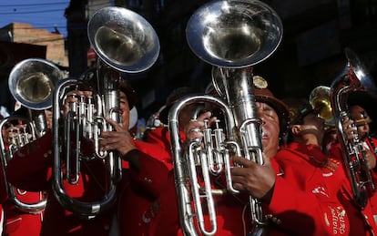 In this May 30, 2015 photo, musicians of the Poopo de Oruro band play during the annual parade in honor of "El Senor del Gran Poder," or "The Lord of Great Power" in La Paz, Bolivia. Brass bands marched and onlookers cheered over the weekend as the dancers performed elaborate routines in their quest for prizes. (AP Photo/Juan Karita)