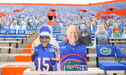 Florida Gators fans sit amid cutouts of fans before the start of a game against South Carolina at Ben Hill Griffin Stadium, in Gainesville, Fla. Oct. 3, 2020