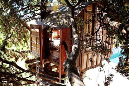 The same folks renting out the teepee also offer a treehouse. Built three meters off the ground and sandwiched in between two cypresses, getting inside entails climbing a ladder and crossing a suspended footbridge.