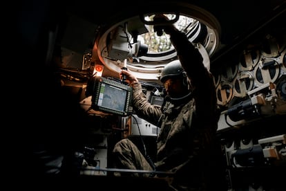 A Ukrainian soldier in the control cabin of a Polish-made Krab self-propelled gun on the Donetsk front.