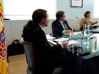 Pablo Iglesias, Yolanda Díaz y José Luis Escrivá, en una reciente videoconferencia.