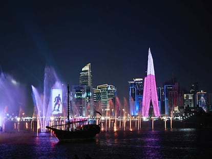 This picture taken from Doha's Corniche promenade shows a nightshot of the city on November 20, 2022, during the opening day of the Qatar 2022 World Cup football tournament. (Photo by Anne-Christine POUJOULAT / AFP)