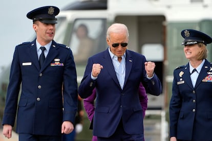 President Joe Biden walks with Capt. Eric Anderson, deputy director of flightline protocol for the 89th Airlift Wing, and Col. Angela Ochoa, commander of the 89th Airlift Wing, right, before leaving Andrews Air Force Base, Md., Friday, March 8, 2024, to travel to Philadelphia for a campaign event.