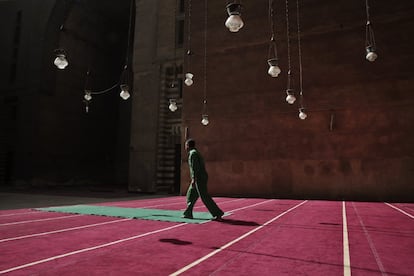 A worker cleans carpets at the Sultan Hassan Mosque and Madrassa in Cairo, Egypt, Wednesday, Oct. 7, 2015. The mosque and madrassa is considered to be a religious school for all four main Sunni 'madaheb' or schools of thought in Islam. The four consist of Hanafi, Maliki, Shafi'i, and Hanbali. (AP Photo/Nariman El-Mofty)