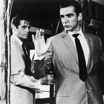 Jack Lord hold Sean Connery at gunpoint in a still from the James Bond film, 'Dr. No,' directed by Terence Young, 1962. United Artists (GETTY IMAGES)