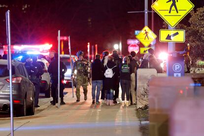 Students gather on the campus of Michigan State University after a shelter in place order was lifted early Tuesday, Feb. 14, 2023, in East Lansing, Mich.