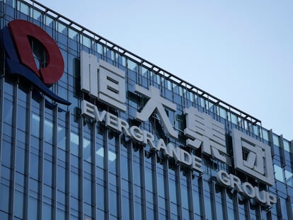 FILE - The Evergrande Group headquarters logo is seen in Shenzhen in southern China's Guangdong province on Sept. 24, 2021. Shares of debt-laden property developer China Evergrande Group soared Tuesday, Oct. 3, 2023, after they resumed trading in Hong Kong following a suspension last week. (AP Photo/Ng Han Guan, File)