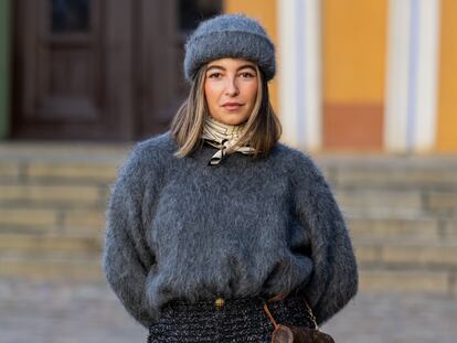 Influencer Benthe Liem wearing a cashmere hat and sweater during Copenhagen Fashion Week, in February 2023.