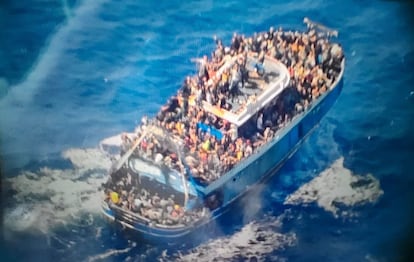 This undated handout image provided by Greece's coast guard on Wednesday shows scores of people covering practically every free stretch of deck on a battered fishing boat that later capsized and sank off southern Greece. 