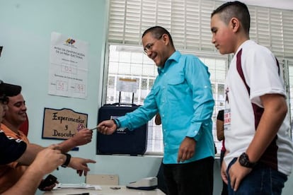 Ernesto Villegas, the ruling PSUV party's candidate in Caracas, casts his vote on Sunday.