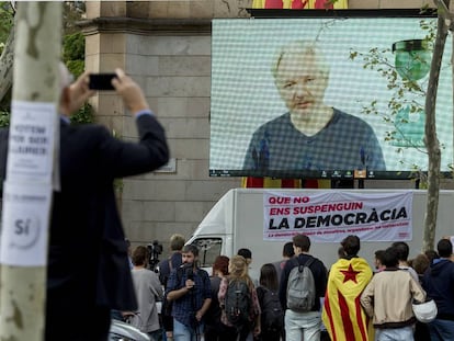 Julian Assange speaks to university students in Barcelona on Tuesday via videolink.