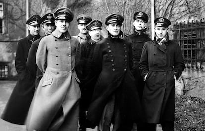 Dutch officers in Colditz Castle, with one of the dolls they used to confuse German guards during counts.