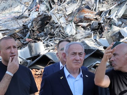 Israel's Prime Minister Benjamin Netanyahu visits the site of the Weizmann Institute of Science, which was hit by missiles fired from Iran, in the central city of Rehovot on Friday, June 20, 2025. (Jack Guez/Pool Photo via AP)