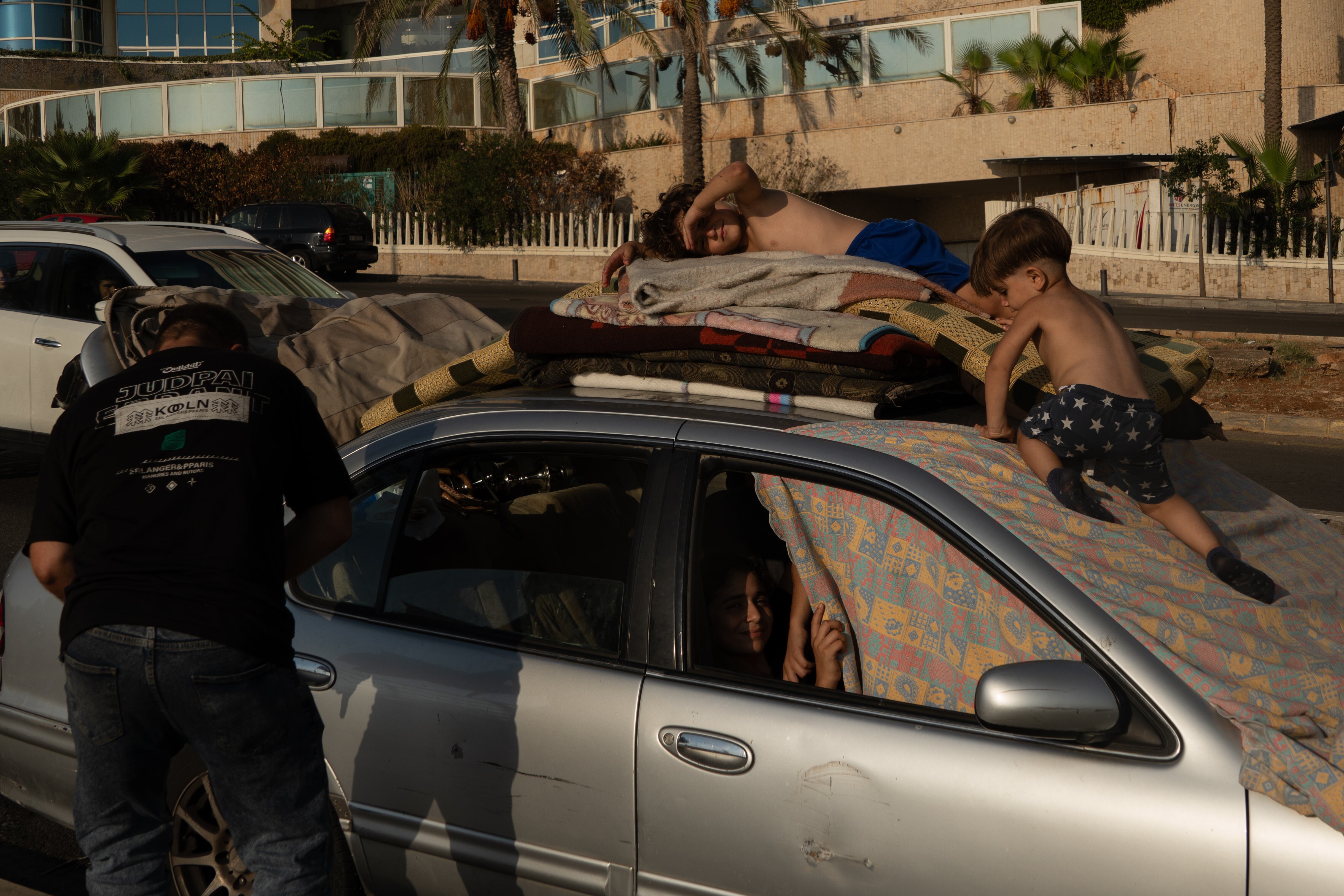 Many of those who fled have nowhere to go. This family, which fled from Dahye, had been sleeping in their car, parked outside Ramlet al Baida beach in Beirut for two weeks.