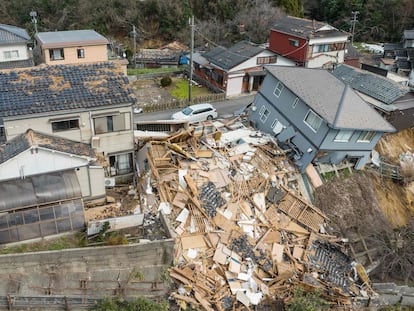 This aerial photo shows damaged and destroyed homes along a street in Wajima, Ishikawa prefecture on January 2, 2024.