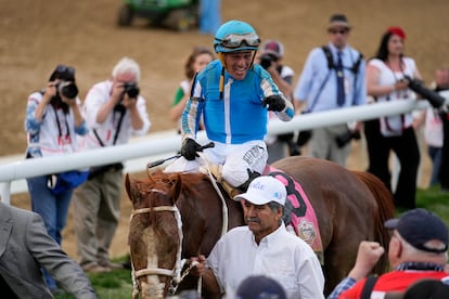 Javier Castellano, atop Mage, celebrates on his way to the winner's circle after winning the 149th running of the Kentucky Derby horse race at Churchill Downs on May 6, 2023, in Louisville, Kentucky.