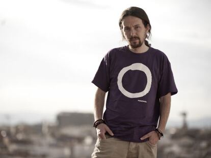Podemos leader Pablo Iglesias wearing a T-shirt with the party logo.