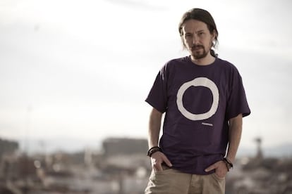 Podemos leader Pablo Iglesias wearing a T-shirt with the party logo.