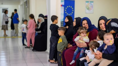A group of Syrian refugees wait in a Şanlıurfa migration center in southeastern Turkey on October 17.