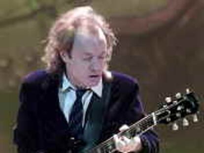 Angus Young of the Australian hard rock band AC DC is performing on stage during a concert in Zurich, Switzerland, Saturday November 18, 2000. (AP Photo/Michele Limina)