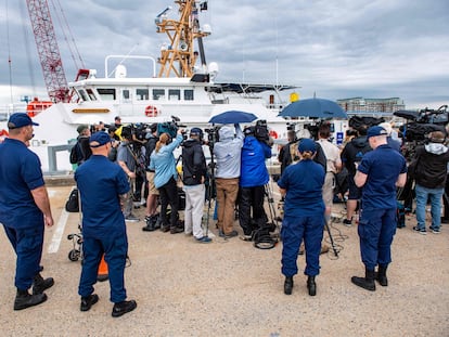 Members of the Coast Guard watch as US Coast Gurad Captain Jamie Frederick speaks during a press conference about the search efforts for the submersible that went missing near the wreck of the Titanic, at Coast Guard Base in Boston, Massachusetts, on June 20, 2023. The Titan submersible with five people on board has "about 40 hours of breathable air" left, Frederick said Tuesday. (Photo by Joseph Prezioso / AFP)