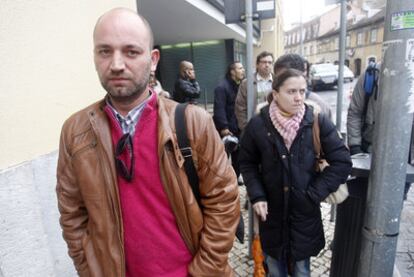 Portuguese salesman Carlos Macedo waits outside the Angolan embassy in Lisbon to sort out his work papers.