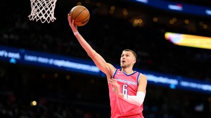 Washington Wizards center Kristaps Porzingis (6) goes to the basket during the first half of an NBA basketball game against the Boston Celtics, Tuesday, March 28, 2023, in Washington.
