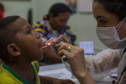 Doctors distribute medication to Warao indigenous people in Manaus, Brazil