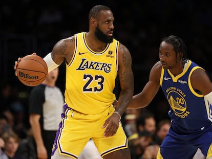 Los Angeles Lakers forward LeBron James (23) matches up against Golden State Warriors forward Jonathan Kuminga (00) during the first half at Crypto.com Arena, in Los Angeles, on Oct 12, 2023.