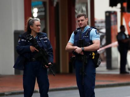 Police stand guard at a cordoned off area near the site of a shooting, in Queen Street, Auckland, New Zealand, 20 July 2023.